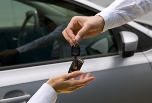 woman receiving car key from man